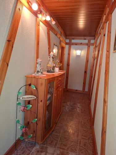 a hallway in a cabin with a wooden ceiling at Pension Hubertushöhe in Kulmbach
