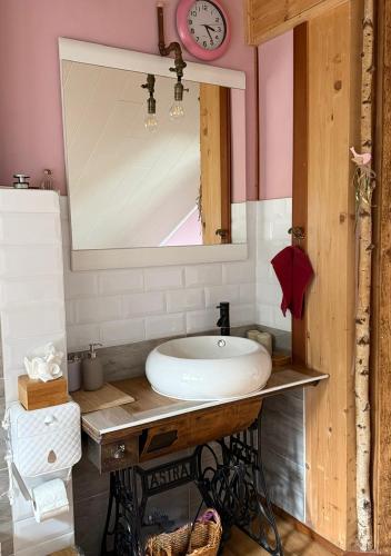 a bathroom with a sink and a mirror at Sunrise Loft in Bingen am Rhein