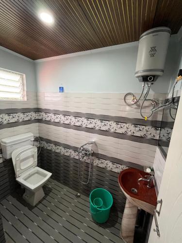 a bathroom with a toilet and a sink at Chyajalo homestay in Darjeeling