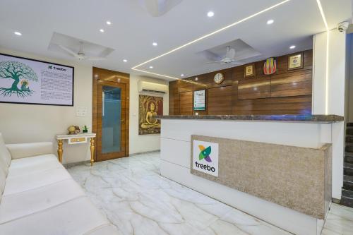 a lobby of a hotel with a reception counter at Treebo Landmark in Visakhapatnam