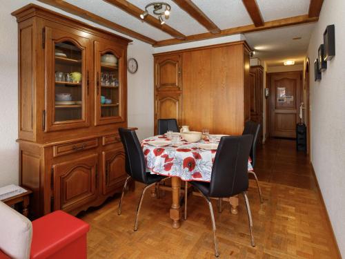 a dining room with a table and chairs at Apartment Terrasse Des Alpes 708 by Interhome in Vermala