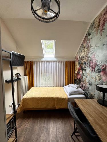 Llit o llits en una habitació de Hotel Baden