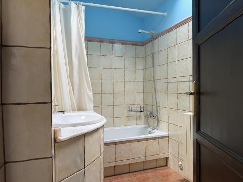 a bathroom with a tub and a sink and a shower at BLEU MAISON-PAZO 2 CL in Campo Lameiro