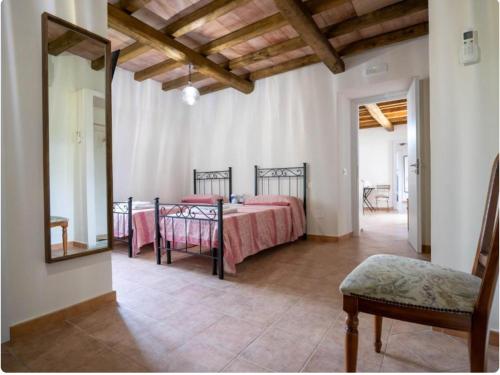 Llit o llits en una habitació de Giardino Siniscalchi