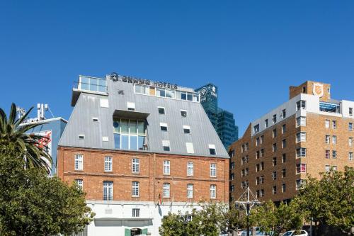 a building on top of a brick building at ONOMO Hotel Waterfront in Cape Town