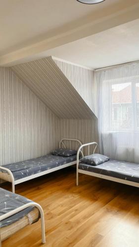 a room with three bunk beds in it at VIP hotel in Mukacheve