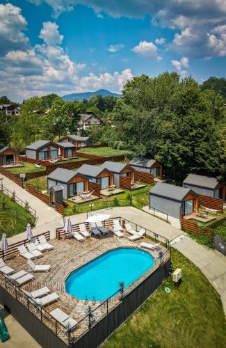 an aerial view of a resort with a swimming pool at Moon Village Comarnic in Sinaia