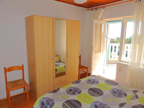 Postel nebo postele na pokoji v ubytování Apartments Zlatko