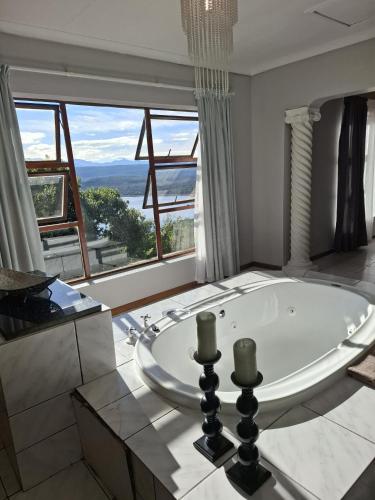 a large bathroom with a large tub in front of a window at Eagles Nest in Sedgefield