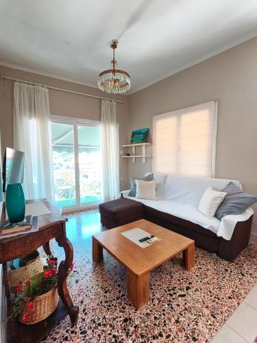 a living room with a couch and a coffee table at Parga Heritage in Parga