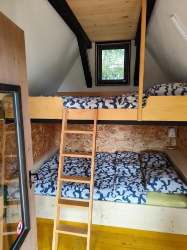 a bedroom with bunk beds in a cabin at Glamping Gradiško in Nova Vas