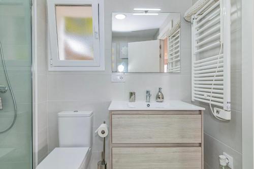 a white bathroom with a sink and a toilet at "The Chill Pad In Cotobro A Boutique Style Studio Where Chillin Is Easy" in Almuñécar