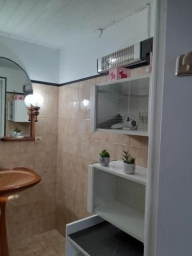 a bathroom with a sink and a mirror at Oustal marcellin in Fanjeaux