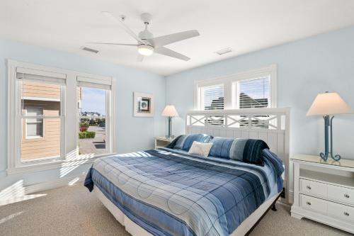 a bedroom with a bed and a ceiling fan at BCBPV1411 Ballast Point in Manteo