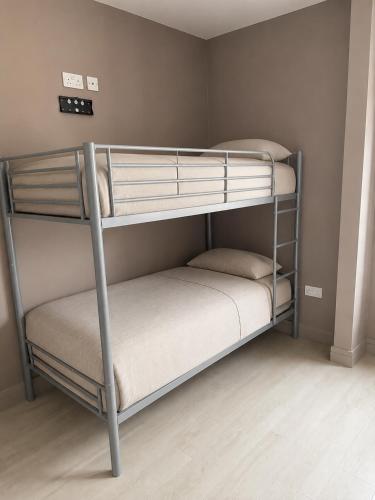 two bunk beds in a small room with at Cosy apartment - Na Creagáin in Tully