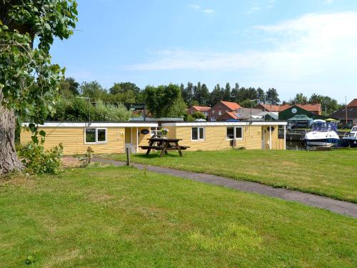 a campsite with a picnic table in front of it at Ardea - Uk12695 in Stalham