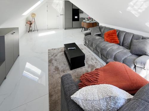 a living room with a couch and a table at Apartment 5 - Uk51650 in Maldon