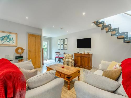 a living room with a couch and a table at Ash Hill - Uk36199 in Fordingbridge