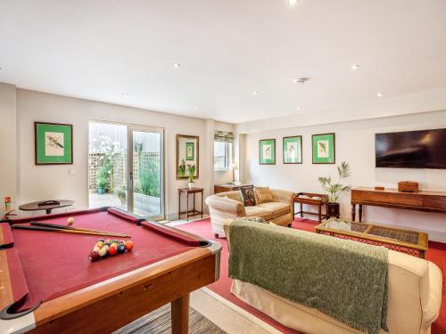 a living room with a pool table at Homewood - Uk36205 in Fordingbridge