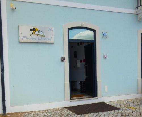 a door to a building with a sign on it at Pinhal Litoral in Marinha Grande