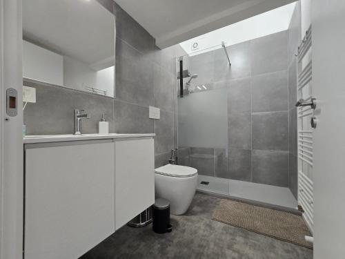 a bathroom with a toilet and a sink and a shower at Vista Duomo Foligno in Foligno