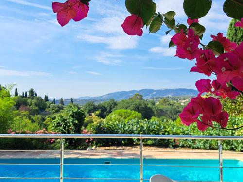 a view from the balcony of a house with flowers at Bed and Breakfast with a View & Pool Bastide de Marie Grasse in Grasse
