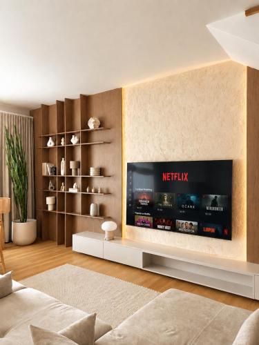 a living room with a flat screen tv on a wall at oto harmonia in Rąbinek