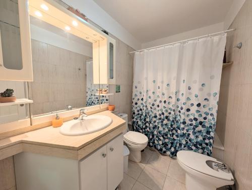 a bathroom with a sink and a toilet and a shower at CHC - Olivia Sunset II in Puerto de Santiago