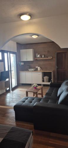 a living room with a couch and a table at The Loft'y #3 in Famara