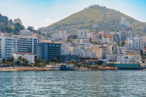 a view of a city from the water at Hotel Saranda Butrinti, Affiliated by Meliá in Sarandë