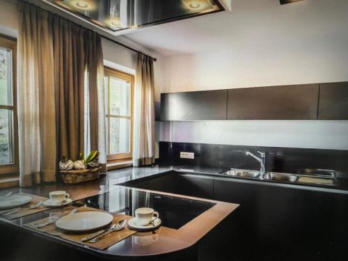 a kitchen with a sink and a counter top at Casa Belluno in Belluno