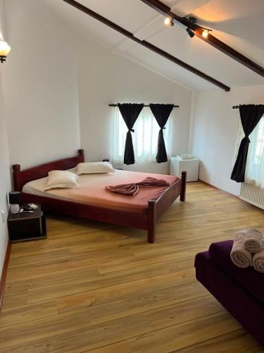 a bedroom with a large bed in a room at Casa Dyny 2 Mai in 2 Mai