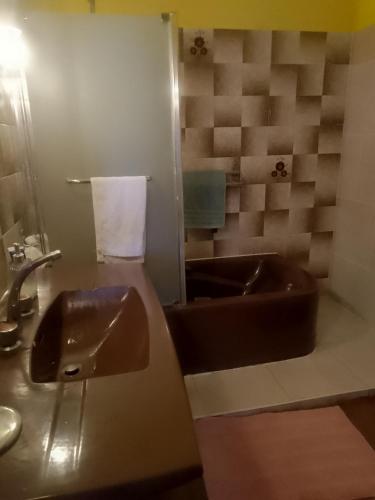 a bathroom with a sink and a toilet and a mirror at BB des 6 arcs"" in Coulonces