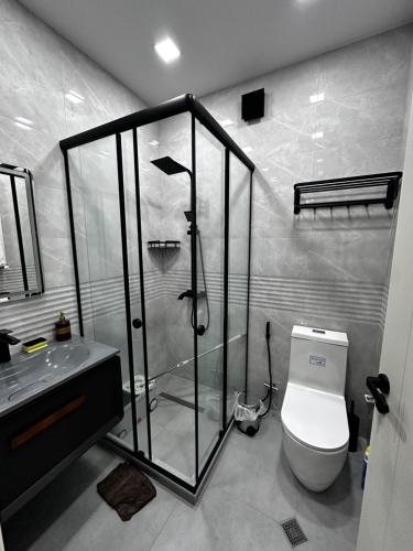 a bathroom with a shower and a toilet and a sink at "Mtis broli 77"-Mzetamze-Borjomi in Mzet'amze