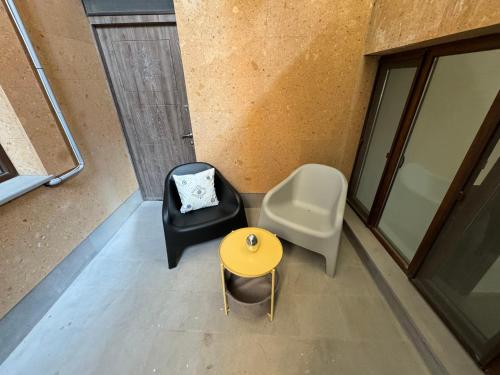 an overhead view of a room with a table and a chair at Hostel Velvet Vouge in Yerevan