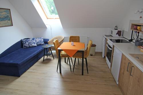 a small living room with a table and a couch at Apartmá Jablonec in Jablonec nad Nisou