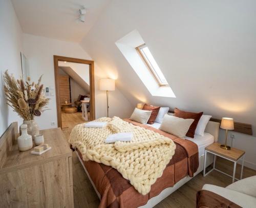 a bedroom with a large bed in a room at Askana in Białka Tatrzańska