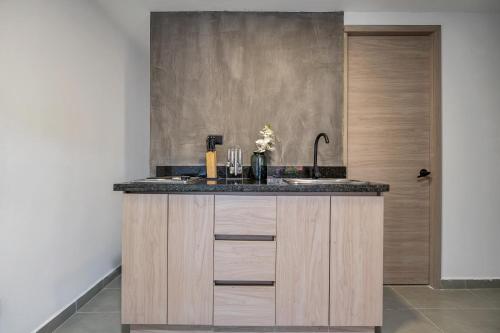 a kitchen with a sink and a counter top at Park 38 in Envigado