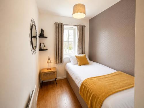 a bedroom with two beds and a window at 3 Bedroom House By Trinity Stays Short Lets & Serviced Accommodation Cambridge With Free WiFi & Parking in Cambridge