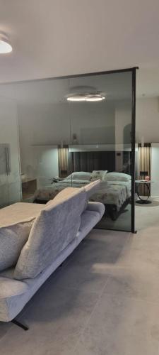 a bedroom with two beds and a mirror at House K and M in Pag