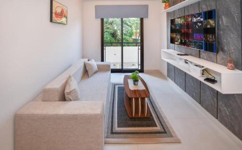 a living room with a couch and a table at Modern One-Bedroom for Work and Relax in Fernando de la Mora