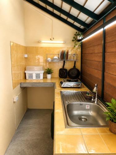 a small kitchen with a sink and a counter at Baan Mon Hill in Patong Beach