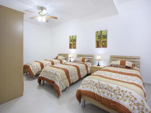 Posteľ alebo postele v izbe v ubytovaní Villa Sunnyside