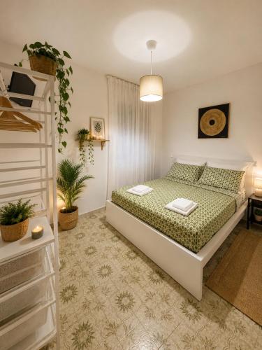 a bedroom with a large bed and a ladder at Il Focolare in Subiaco
