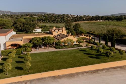 an aerial view of a park with trees and a building at Quinta De Catralvos in Azeitao