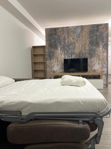 a bedroom with a bed and a tv in it at Nova Stay in Rome