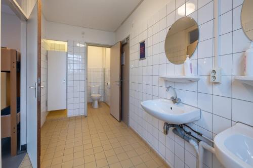 a bathroom with a sink and a toilet at Stayokay Hostel Arnhem in Arnhem