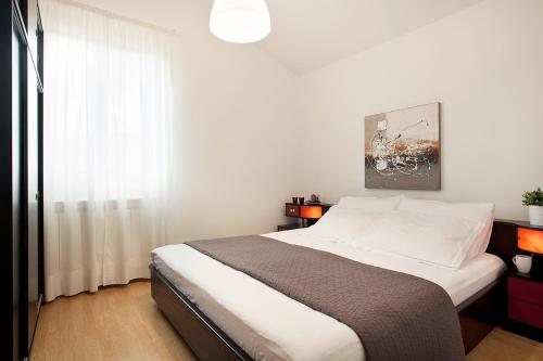Postel nebo postele na pokoji v ubytování Apartments Agava Romantic