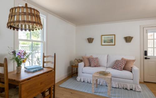 a living room with a couch and a table at The Lightkeeper’s Inn in Edgartown
