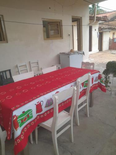 a table with a red and white table cloth on it at Tata Róga in Asunción